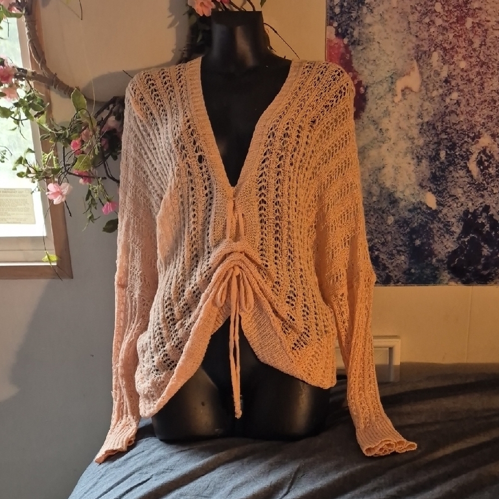 Cream V-Neck Sweater with Intricate Knit Pattern